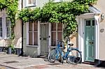 A Blue Bicycle Leaning Against A House In Sandwich Kent Stock Photo