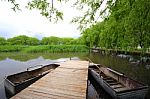 A Bridge And Boats  On The Lake Stock Photo