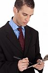A Business Man With Notepad Stock Photo