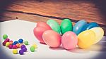 A Few Colorful Easter Eggs As A Flower Shape With Candies Over Wood Background Close Up Happy Easter Stock Photo
