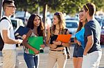 A Group Of Friends Talking In The Street After Class Stock Photo
