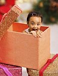 A Little Child In Gift Box Stock Photo