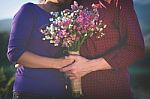 A Romantic Couple Holding Valentines Gift And Flowers, Vintage T Stock Photo