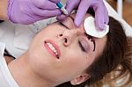 A Woman Getting Permanent Make Up Stock Photo