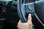A Woman Hand Pushes The Mode Hold Control Button On A Steering Wheel Stock Photo