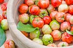 Acerola Cherry In Wood Bowl Stock Photo