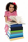 Active Kid Reading A Book And Learning Stock Photo