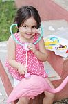 Adorable Little Girl Playing Doctor With Stethoscope Out Door Stock Photo