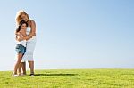 Affectionate Mother Embracing Stock Photo