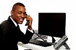 African Businessman Holding Phone Stock Photo