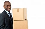 African Corporate Man Holding Card Box Stock Photo