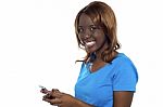African Girl Messaging Her Friends Stock Photo