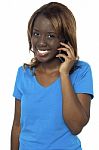 African Girl Talking Over Phone Stock Photo