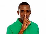 African Guy Showing Silence Gesture Stock Photo