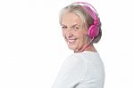 Aged Woman Enjoying Today's Music Stock Photo