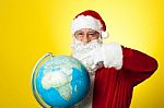 Ages Man In Santa Costume Holding Globe Stock Photo