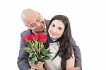 American Young Couple With Bunch Of Roses Stock Photo