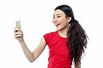 Amused Girl Clicking A Selfie Stock Photo