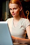 An Attractive Young Woman With Laptop Stock Photo