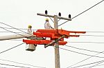 An Electrical Power Utility Worker In A Bucket Fixes The Power Line Stock Photo