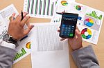 Analyzing Statistics With Smart Phone Calculator Stock Photo