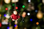 Angel With Christmas Light Ornament Hanging On Christmas Tree Stock Photo