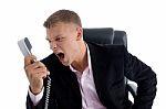 Angry Employee Shouting On Phone Stock Photo