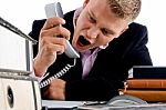 Angry Manager Shouting On Phone Stock Photo