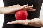 Apple In Hand Stock Photo