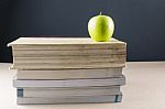 Apple On Books Stock Photo