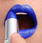 Applying Blue Lipstick Stock Photo