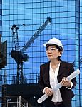 Architect Female And Plan Project On Working Site Stock Photo