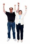 Arms Raised Aged Couple Stock Photo