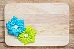 Artificial Flowers On Wood Background Stock Photo