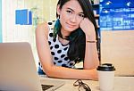Asian Attractive Businesswoman Working With Laptop In The Cafe Stock Photo