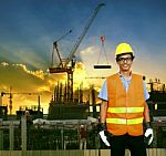 Asian Construction Site Worker Smiling Face And Building Construction Site Background Stock Photo