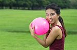Asian Girl And Pink Ball Stock Photo