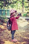 Asian Girl Taking Photos By Digital Camera In Garden. Vintage Effect Tone Stock Photo