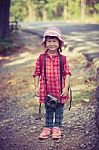 Asian Girl With Digital Camera In Beautiful Outdoor. Vintage Effect Tone Stock Photo