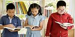 Asian Group Of Kids Study Read Book Together Stock Photo