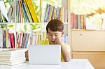 Asian Kid  Using Laptop Stock Photo