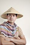 Asian Man Wearing Bamboo Hat Stock Photo