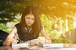 Asian Teen Student Reading Book Preparing For Exam  Stock Photo