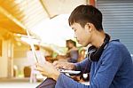 Asian Teenager Using Laptop  Stock Photo