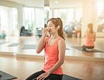 Asian Woman Doing Yoga Indoors Stock Photo