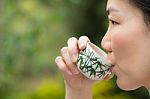 Asian Woman Drinking Tea Stock Photo
