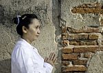 Asian Woman Greets In Temple, Sawasdee Stock Photo