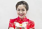 Asian Woman Holding Gold Ingot Stock Photo