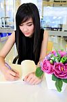 Asian Woman Writing Stock Photo
