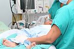 Assistant Preparing A Child For A Surgery Stock Photo